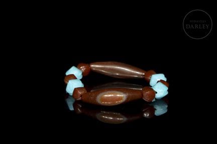 A ceremonial bracelet consisting of an exquisite a