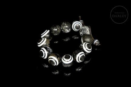 Composed of twelve spherical black agate beads. Ea