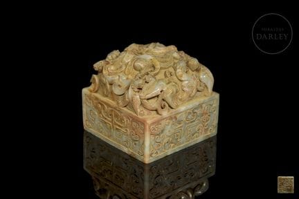 A square-based seal, carved from celadon jade with