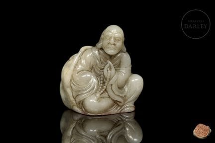 A hand-carved seal made of light celadon-colored n