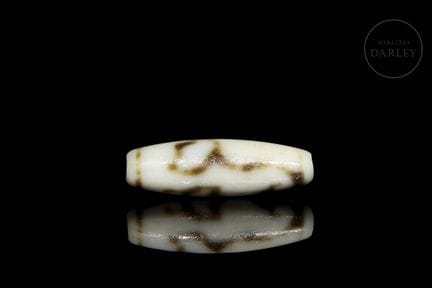 Ritual Dzi bead, crafted from ivory-white agate wi