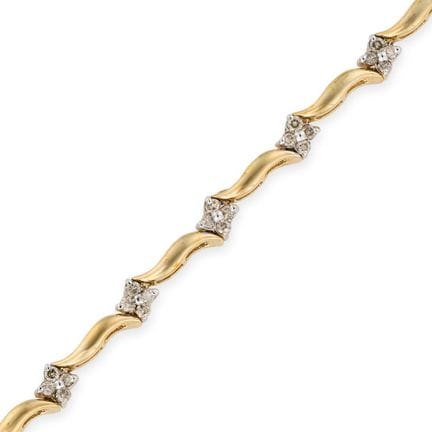 Ein DIAMANTARMBAND aus 14-karätigem Gelbgold, bese