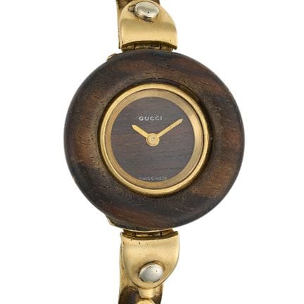 GUCCI, EINE ARMBANDUHR AUS GOLD UND HOLZ, aus 18 K
