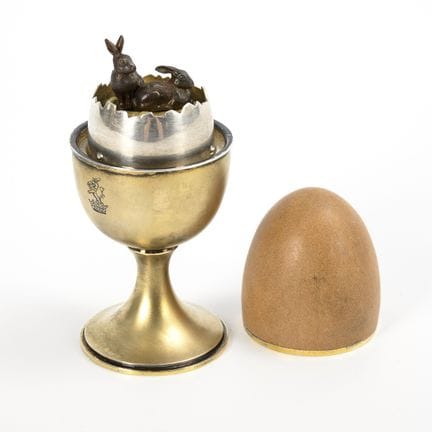 Music Box: Silver egg cup with rabbits.  
 

 On t