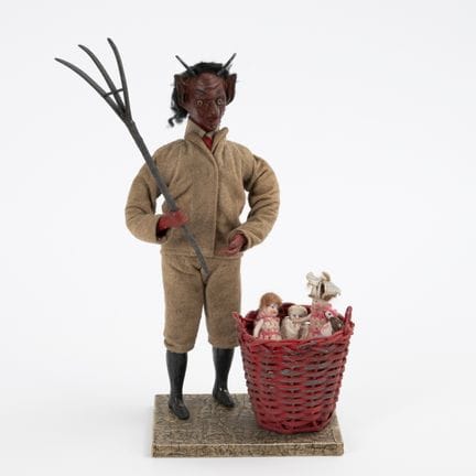 Krampus mit Korb und 4 Püppchen.  
 

 
  
 

 H 3