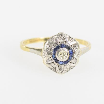 Runder Art déco-Ring mit blauen Farbsteinen und Br