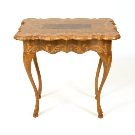 Baroque-style inlaid side table.  
 

 Circa 1900.