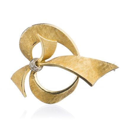 Broche en forme de boucle en or jaune avec diamant
