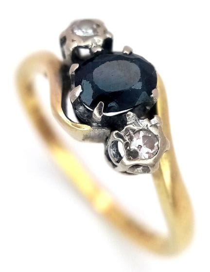 BAGUE EN OR 18 CARATS avec SAPHIR CENTRAL et DÉTAI