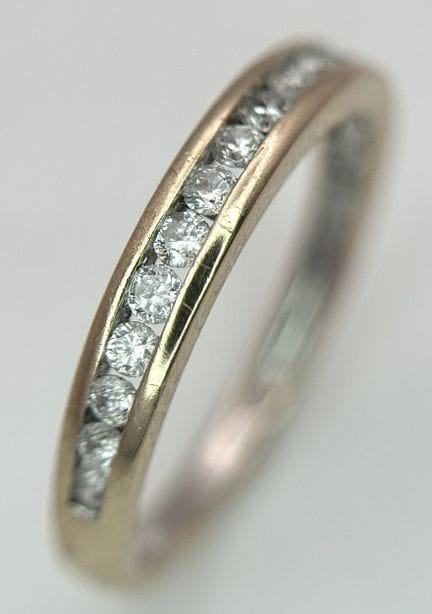 BAGUE « DEMI-ÉTERNITÉ » EN OR JAUNE 18 CARATS, SER