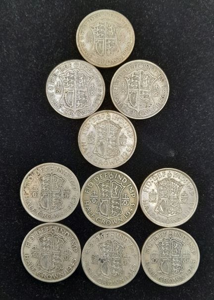 Dieci monete britanniche da mezza corona in argent
