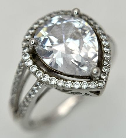 An Elegant Sterling Silver Pear Cut White Stone Se