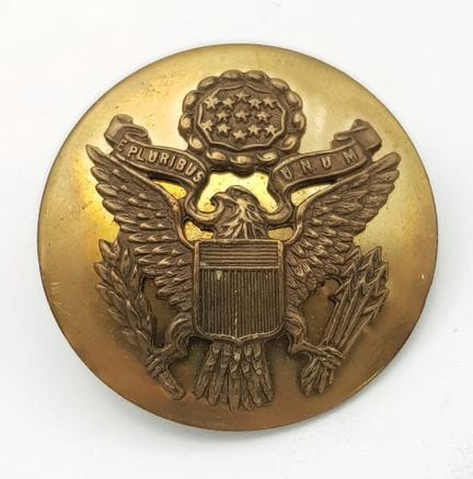 A WW2 Era Enlisted USA Brass Army Hat Badge.