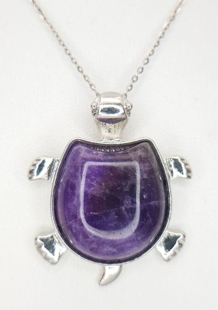 An Amethyst Turtle Pendant on a Silver Chain. 4cm 