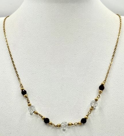 An 18k yellow gold stone set necklace, 3.4g total 