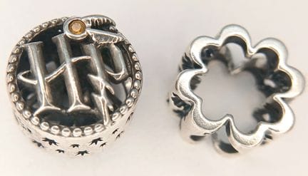 A Pair of 925 Sterling Silver Pandora Charms. One 