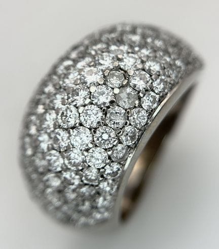 An 18K White Gold and Diamond Cluster Dress Ring. 