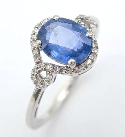 A 950 Platinum, Sapphire and Diamond Ring. A 1.56c