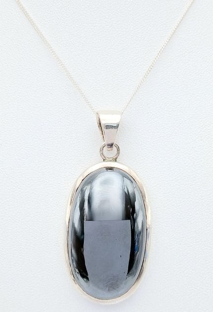 A Sterling Silver and Oval Black Hematite Set Pend