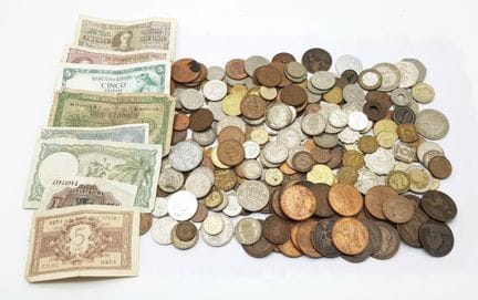 A collection of old coins and notes from around th