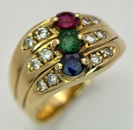 An 18k yellow gold diamond emerald ruby and sapphi