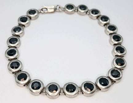 A Stylish Sterling Silver Blue Sapphire Set Tennis
