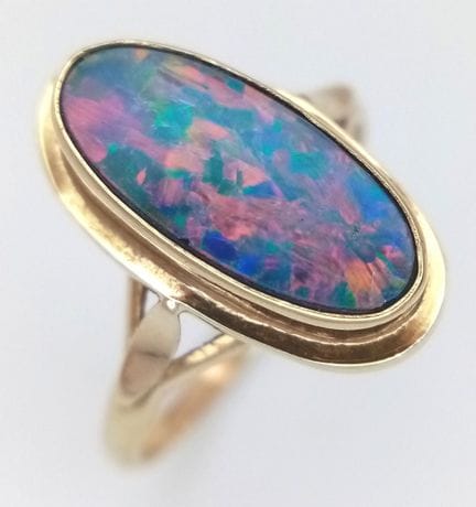 A Beautiful Colouration 9k Yellow Gold Opal Triple