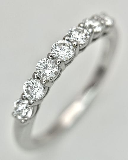 A 14K White Gold, Seven Stone Diamond Ring. C. 0.3