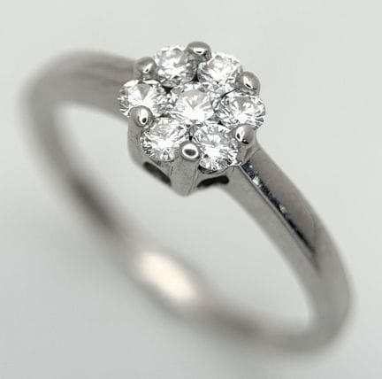 An 18K White Gold, Diamond Ring. 0.22ctw. 2.4g, Si
