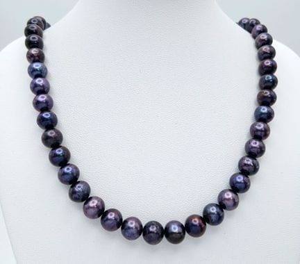 A classic single strand of metallic Purple Freshwa