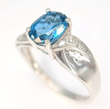 A Hallmarked 2005 Sterling Silver Blue Topaz Love 