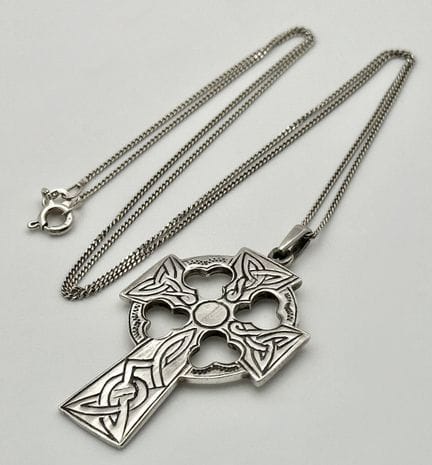 A Sterling Silver Celtic Cross Pendant on a Sterli