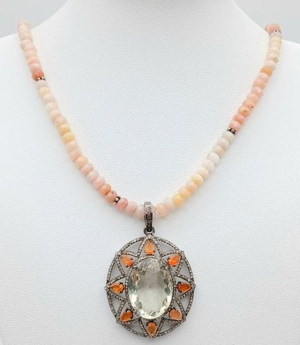 A Citrine, Opal and Diamond Pendant with Moonstone