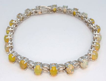 An Elegant Sterling Silver Multi-Fire Opal Set Ten