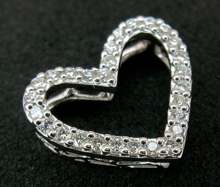 An 18K White Gold (tests as) Heart-Shaped Diamond 