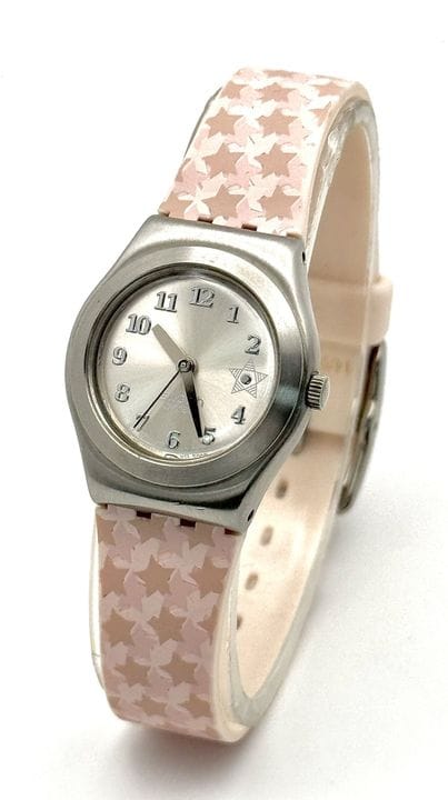 A 2008 Coco Ho Swatch watch, featuring a pink/beig