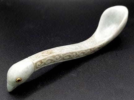 An Antique Carved Jade Bird Spoon. Ruby set eyes. 