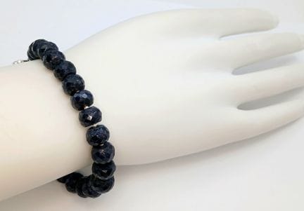 A Blue Sapphire Rondelle Bracelet with an Emerald 