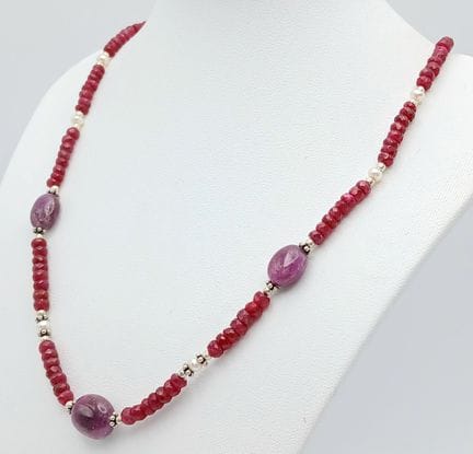 A Ruby Rondelle Necklace with Amethyst Spacers. Ro