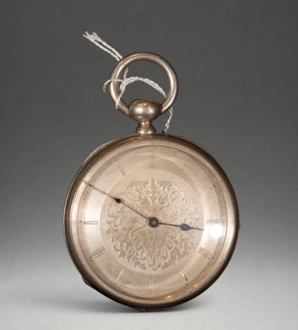 Pocket watch with a decorated dial and Roman numer