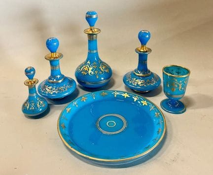 Set of four carafes, a water glass, and a blue opa