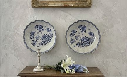 Pair of earthenware cups decorated with flowers in