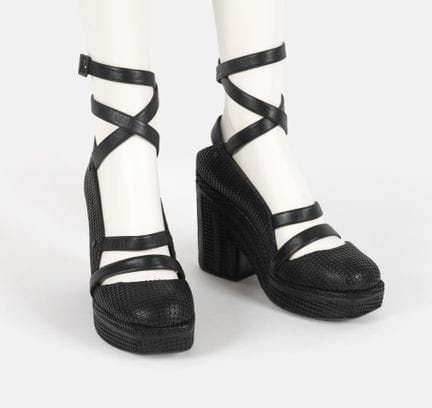 CHANEL
Pair of black leather platform sandals with