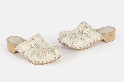 DIOR
Beige leather and wood clogs with floral embr