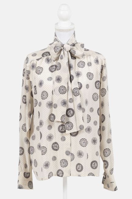 LOEWE
Silk blouse with clock motifs on a beige bac