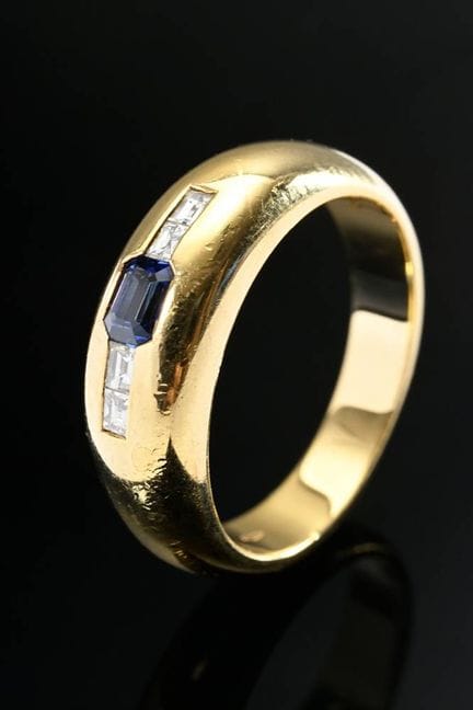 Bague anneau en or jaune 750 avec un saphir et 4 d
