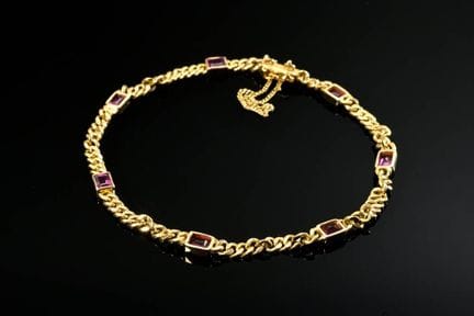Bracelet en or jaune 750 à maillons plats, orné de