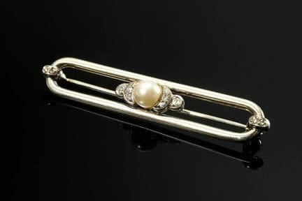 Broche ovale allongée en or blanc 585, ornée d'une