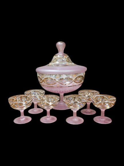 A decorated pink glass punch set consisting of a l