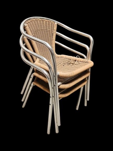 Three armchairs made of metal and woven rope
(Sign